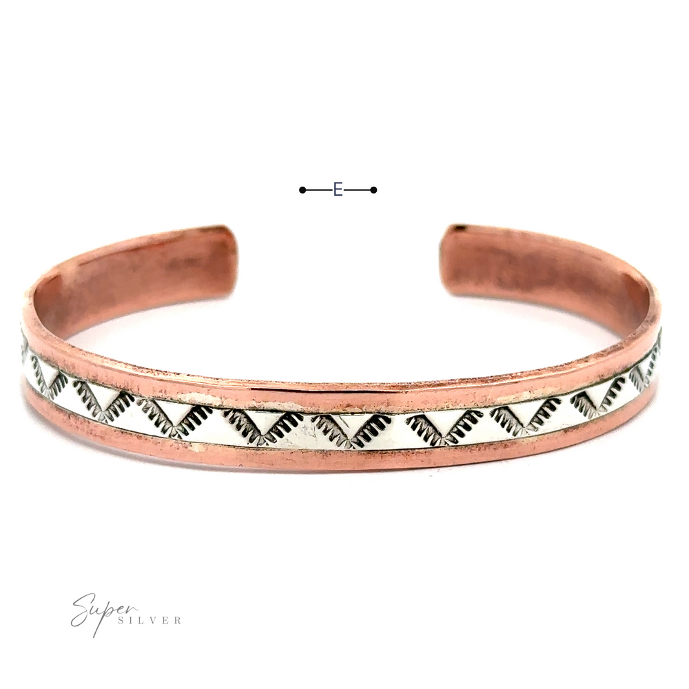 
                  
                    Native American Handmade Copper And Silver Bracelet made from copper and adorned with a captivating zigzag pattern along the center. The open-ended bracelet boasts a polished finish.
                  
                