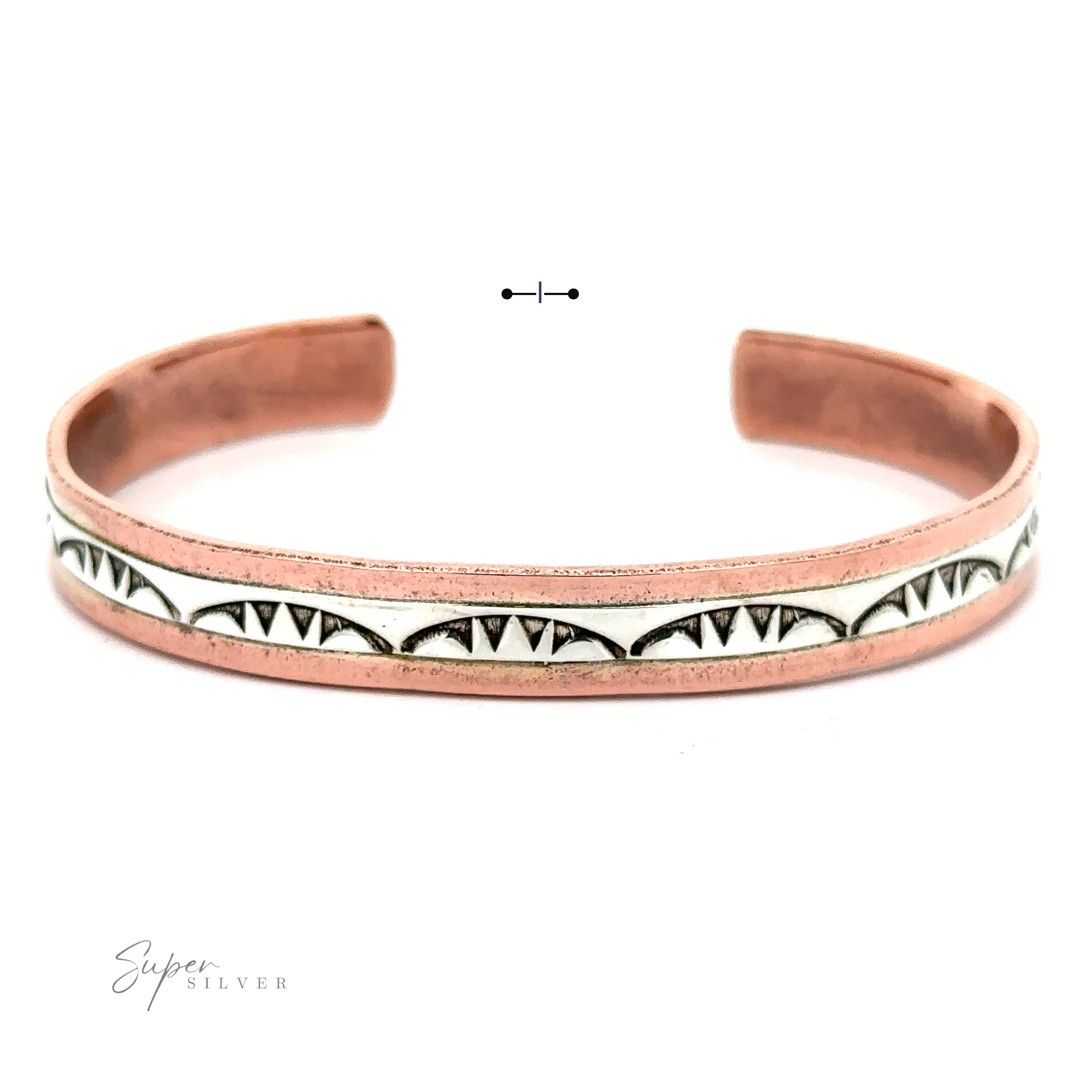 A Native American Handmade Copper And Silver Bracelet with an engraved pattern featuring triangular designs and a contrasting white inlay, inspired by Native American handcrafted artistry.