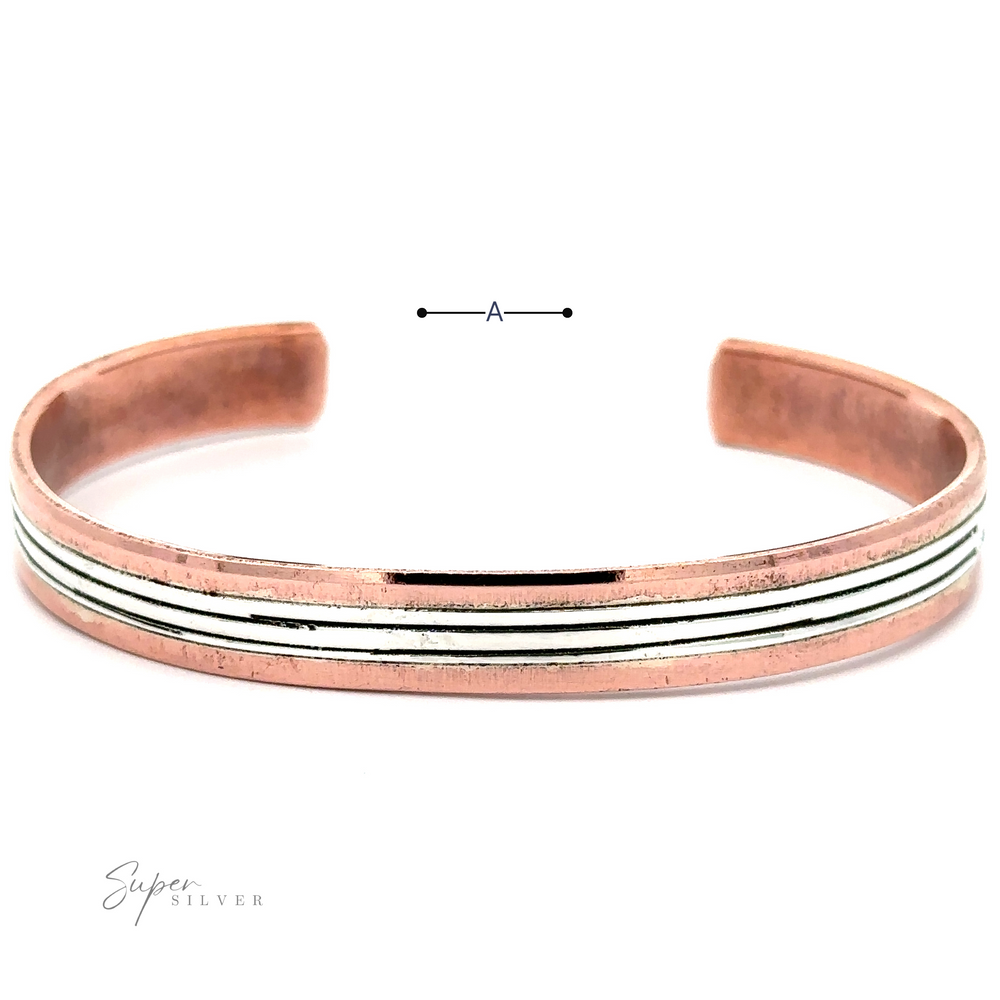 
                  
                    Native American Handmade Copper And Silver Bracelet with an open design, featuring a sterling silver inlaid stripe in the center. The bracelet has smooth edges and a polished finish. "Super Silver" branding is visible in the corner; it exudes the charm of Native American handcrafted artistry.
                  
                