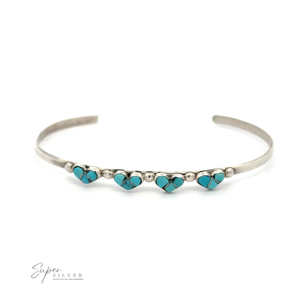 A Turquoise Heart Cuff Bracelet in .925 Sterling Silver, featuring four small heart-shaped turquoise inlays separated by silver beads. The brand name "Super Silver" is visible in the corner, showcasing its Authentic Native American craftsmanship.