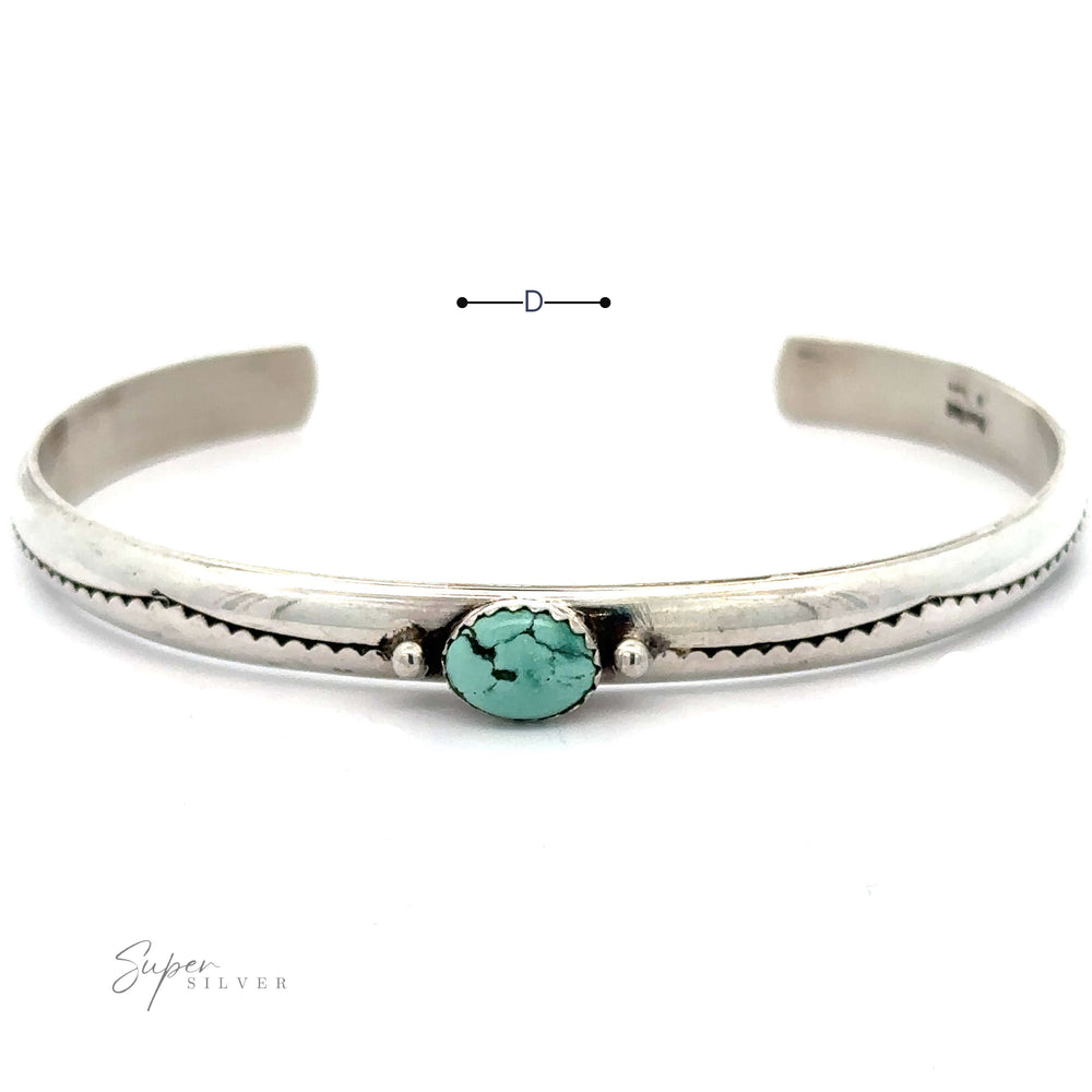 
                  
                    A Striking Native American Turquoise Cuff with Diamond Etching. The .925 Sterling Silver handcrafted Navajo cuff has a simple design, including a measurement marker indicating its diameter. The brand name "Super Silver" is visible in the bottom left.
                  
                