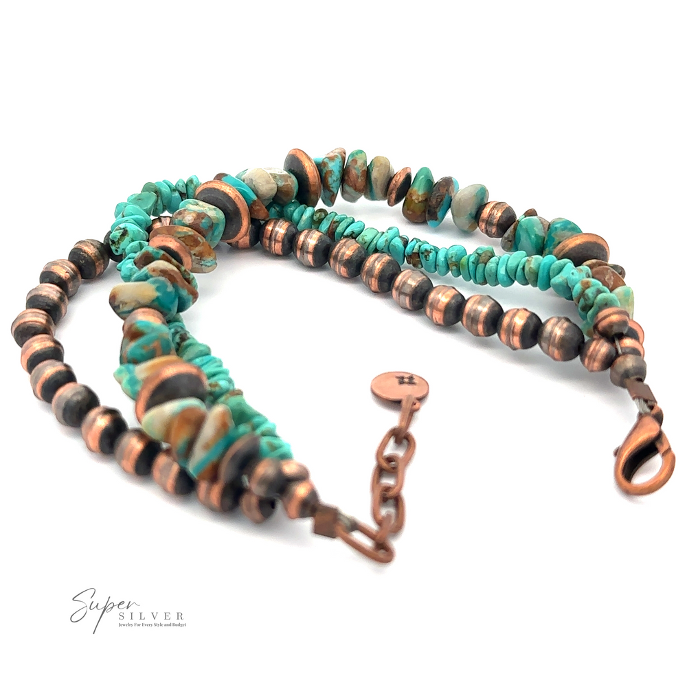 
                  
                    Copper and Turquoise Native American Beaded Bracelet featuring turquoise and copper-colored beads, with a lobster claw clasp and an adjustable chain. A small tag near the clasp displays the brand name "Super Silver." Perfect for adding a touch of bohemian jewelry charm to any outfit.
                  
                
