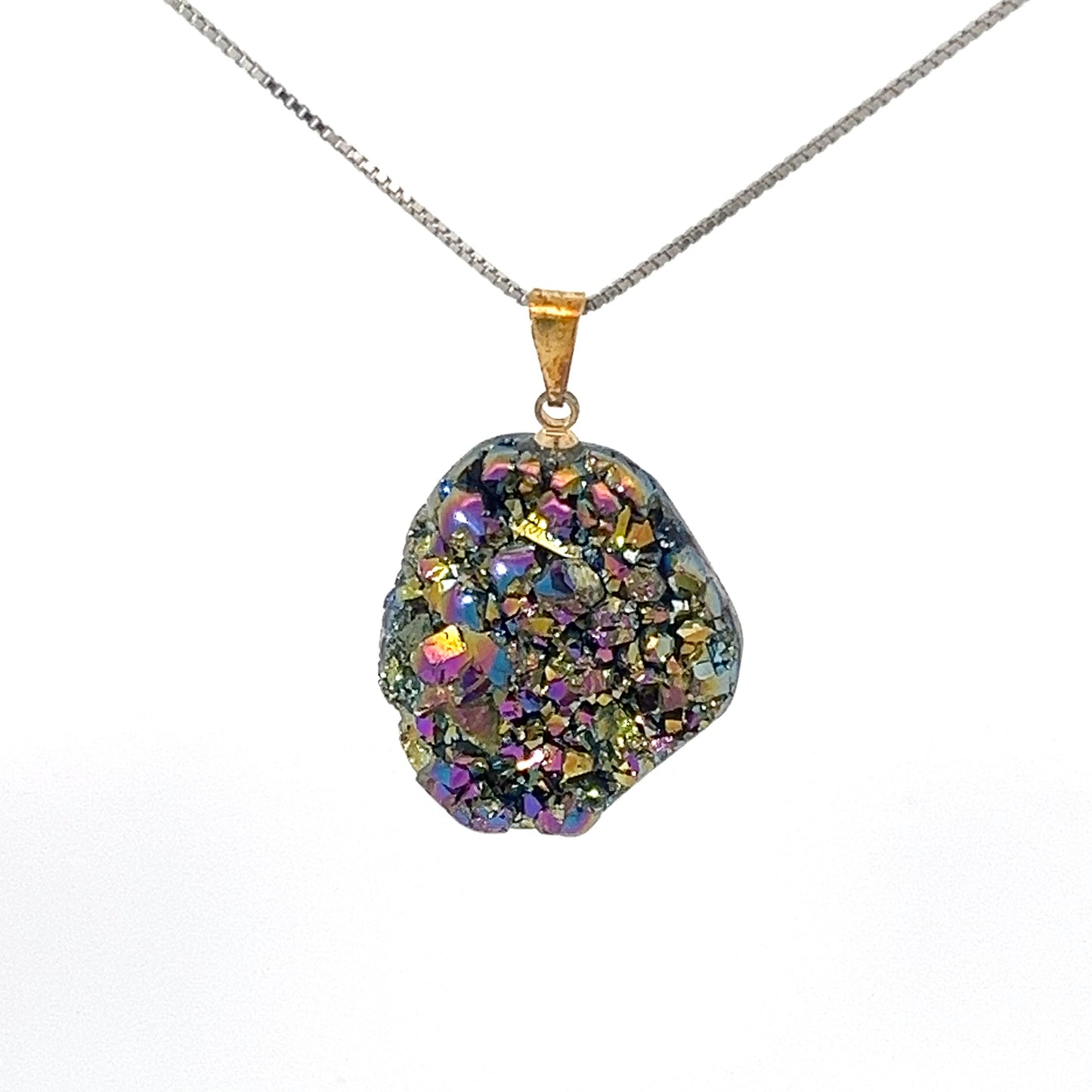 
                  
                    A necklace with a chain and the Dazzling Druzy Pendant, featuring a multicolored, glittery titanium druzy stone with an irregular shape, and a gold plated bail.
                  
                