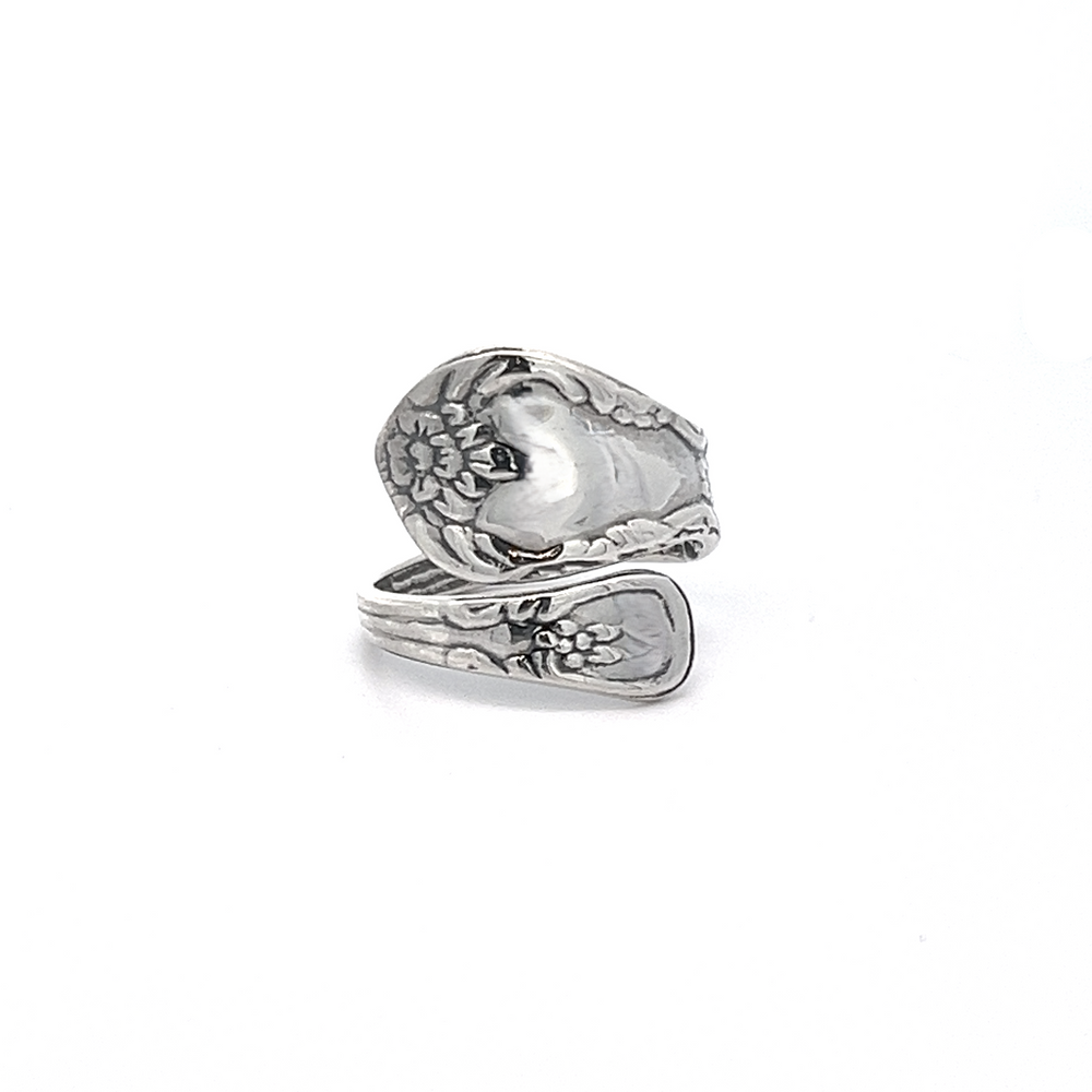 
                  
                    A timeless spoon ring featuring an ornate grapevine motif, crafted in a wrap-around style.
                  
                