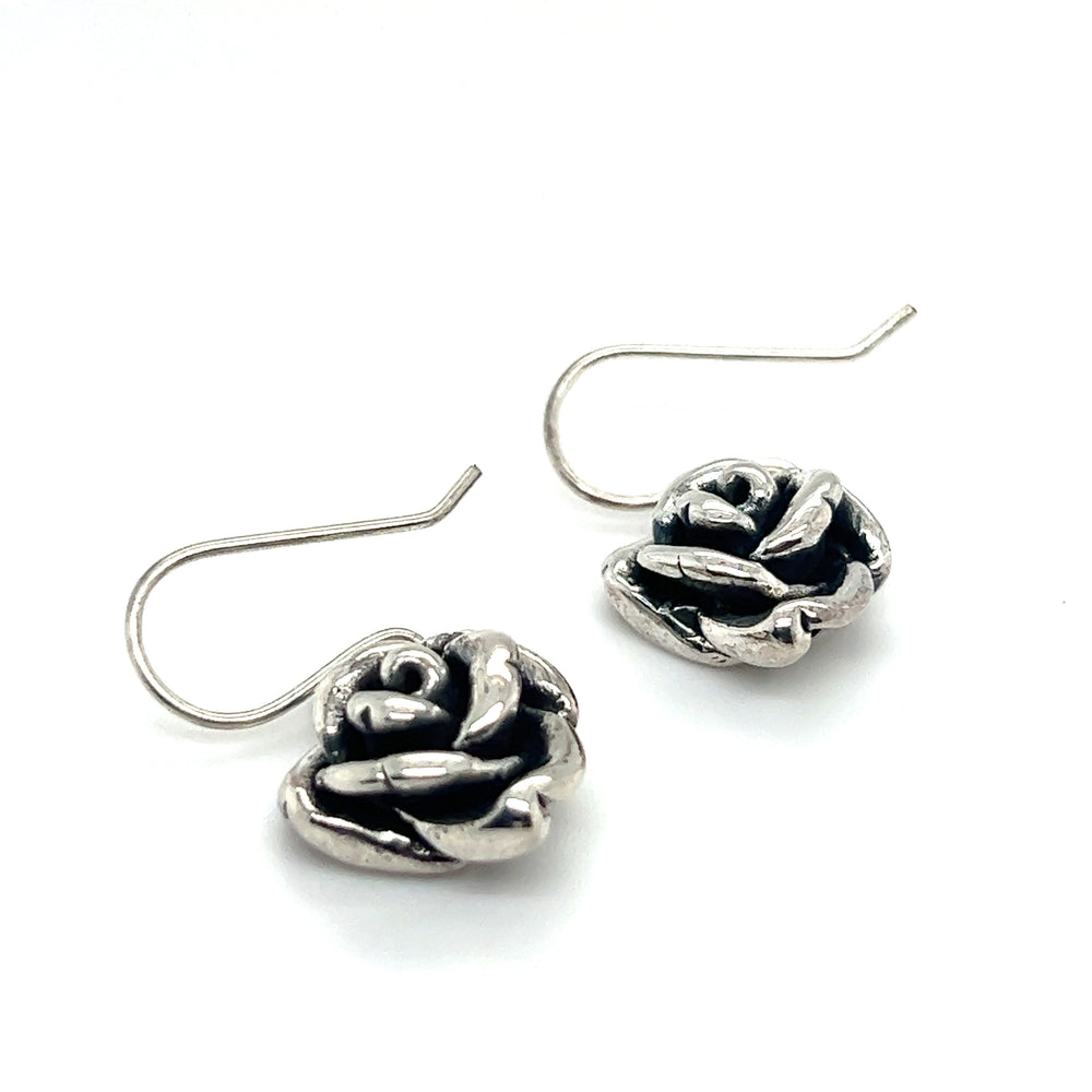 A stunning pair of Super Silver Electroformed Rose Earrings showcasing impeccable craftsmanship on a white background.