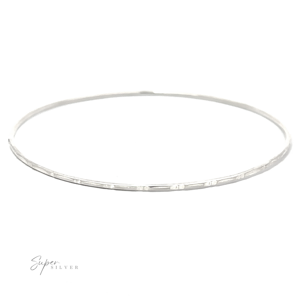 
                  
                    A Sparkling Faceted Bangle Bracelet on a white background.
                  
                