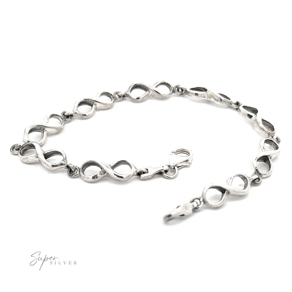 An image of a sleek silver Infinity Sign Link Bracelet with a clasp featuring an infinity link design.