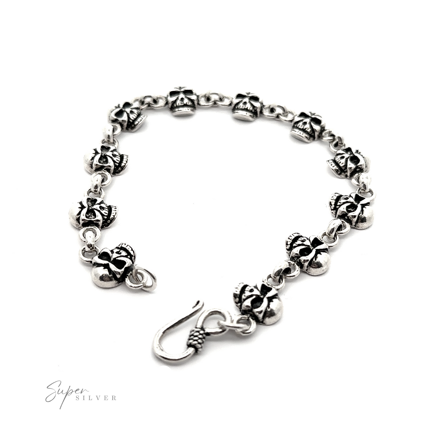 
                  
                    A sterling silver Skull bracelet with black and white flowers on it.
                  
                
