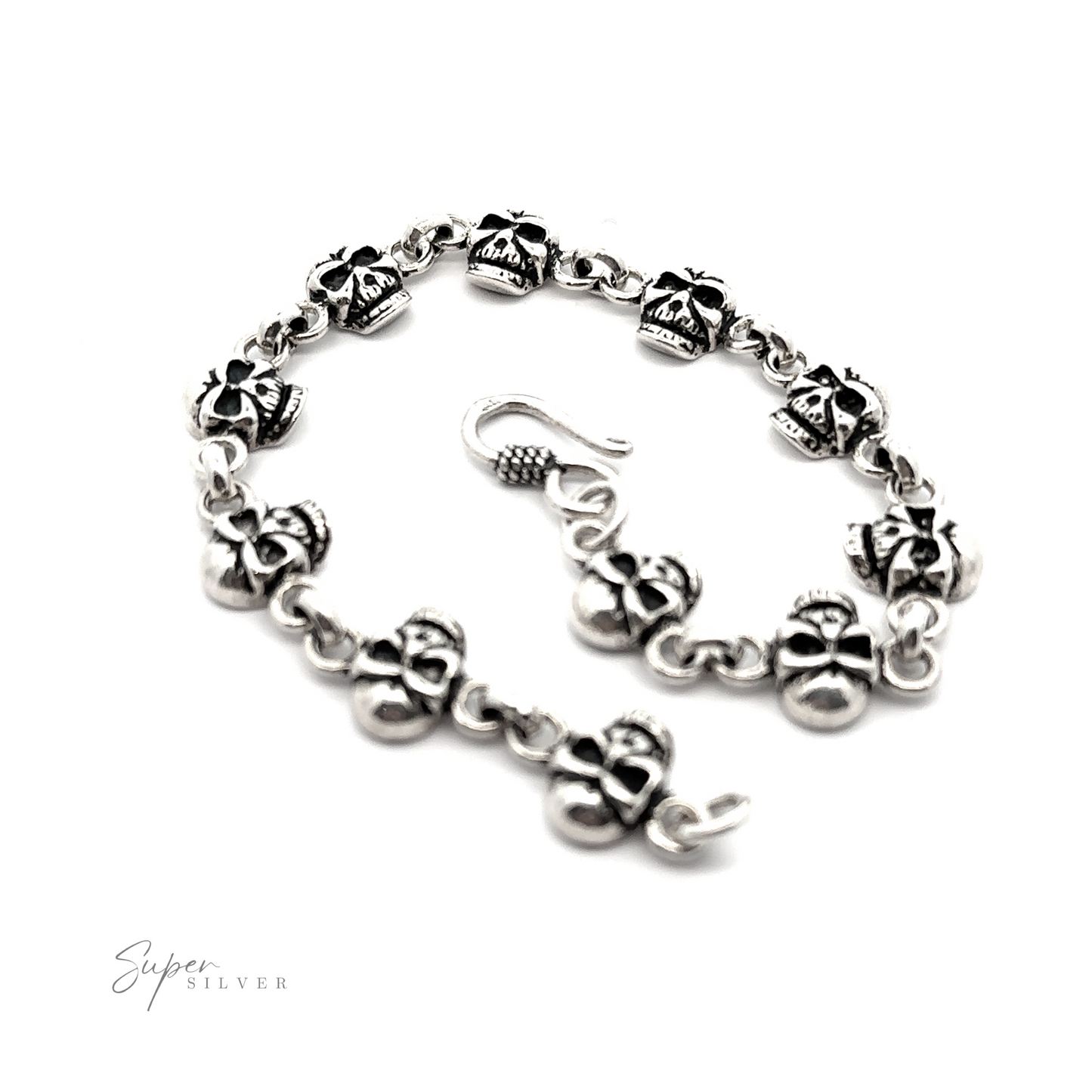 
                  
                    A sterling silver bracelet with a skull on it.
                  
                