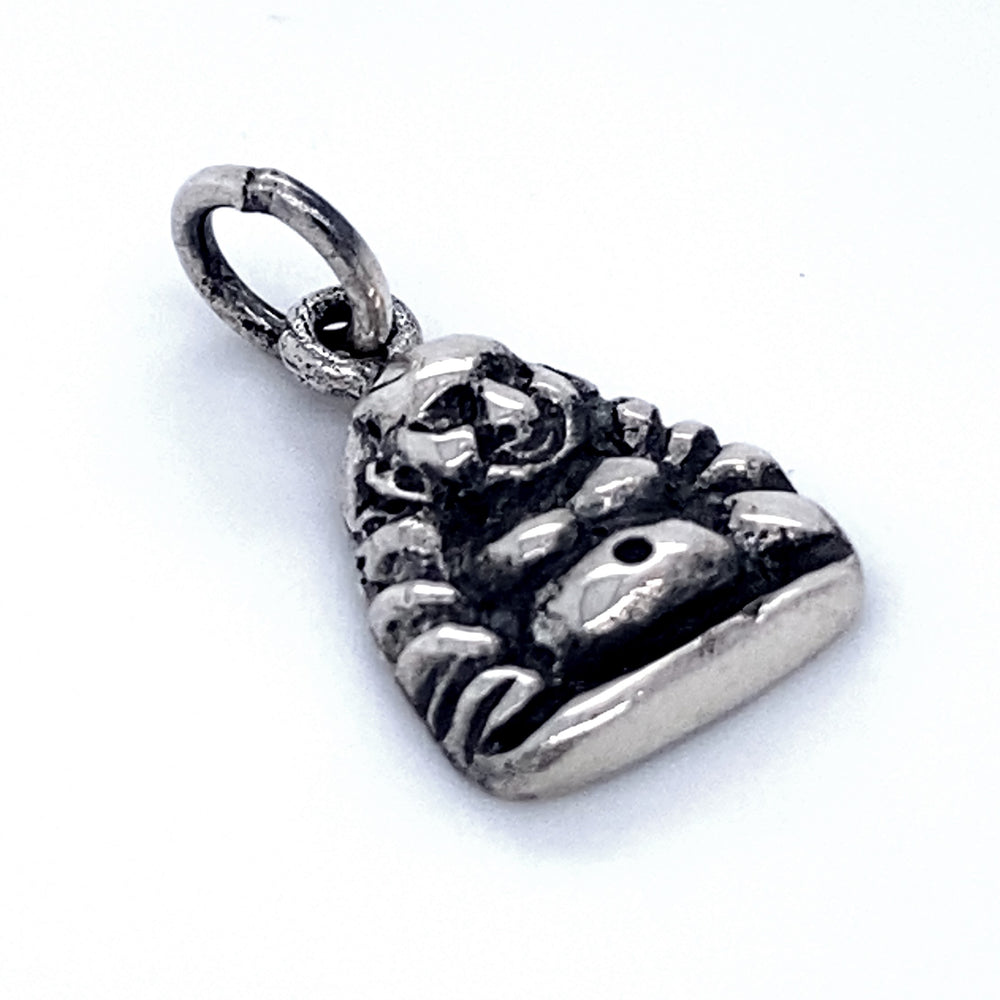 
                  
                    A small, Laughing Buddha Charm depicting a laughing Buddha pendant with a circular loop on top for attaching to a chain or bracelet, believed to bring good luck.
                  
                