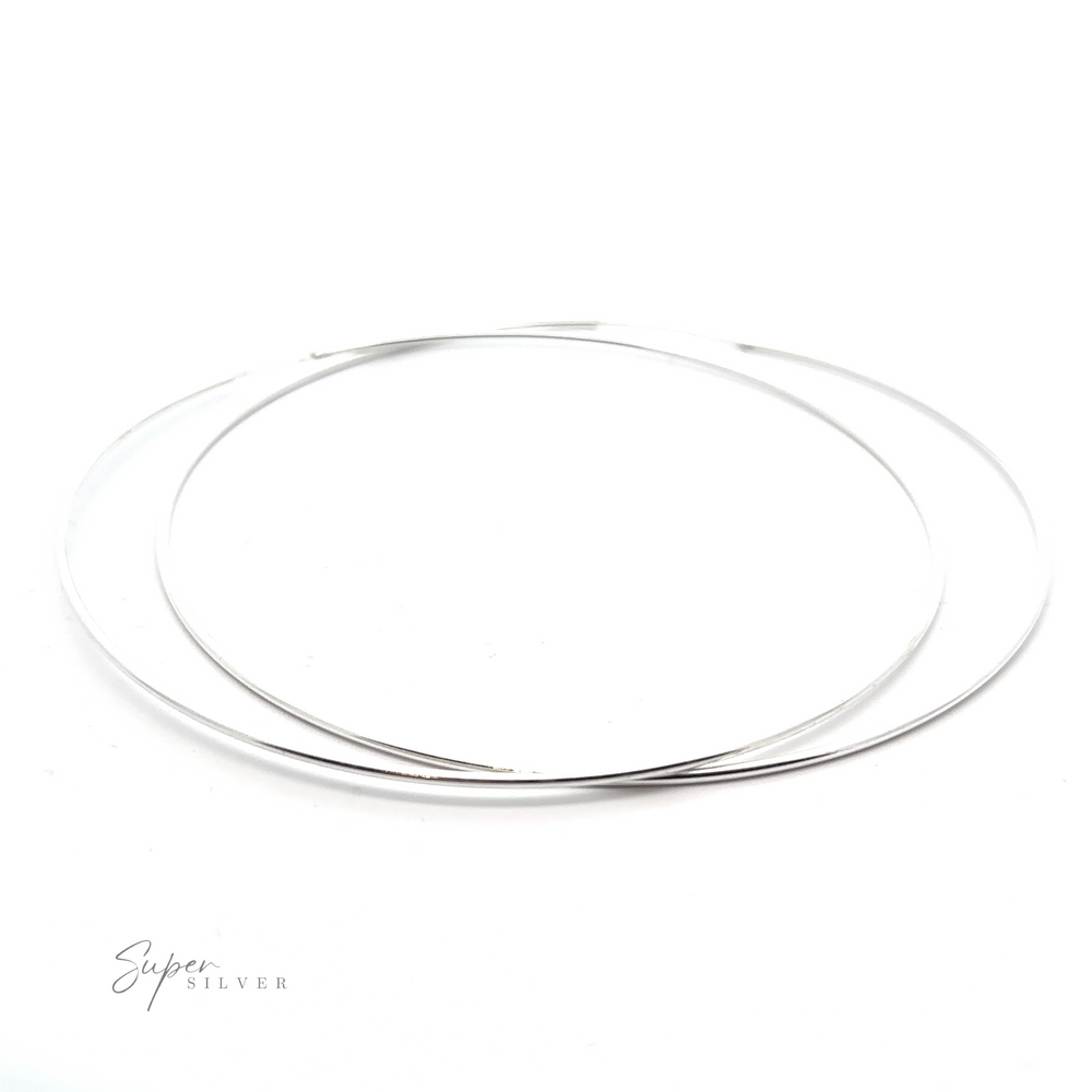 
                  
                    A pair of 1.5mm Infinity Hoops with a versatile flair on a white background.
                  
                
