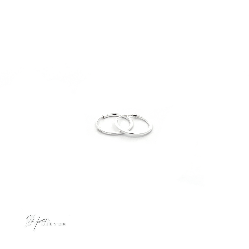 
                  
                    A versatile pair of 1.5mm Infinity Hoops with a minimalist flair, showcased on a white background.
                  
                