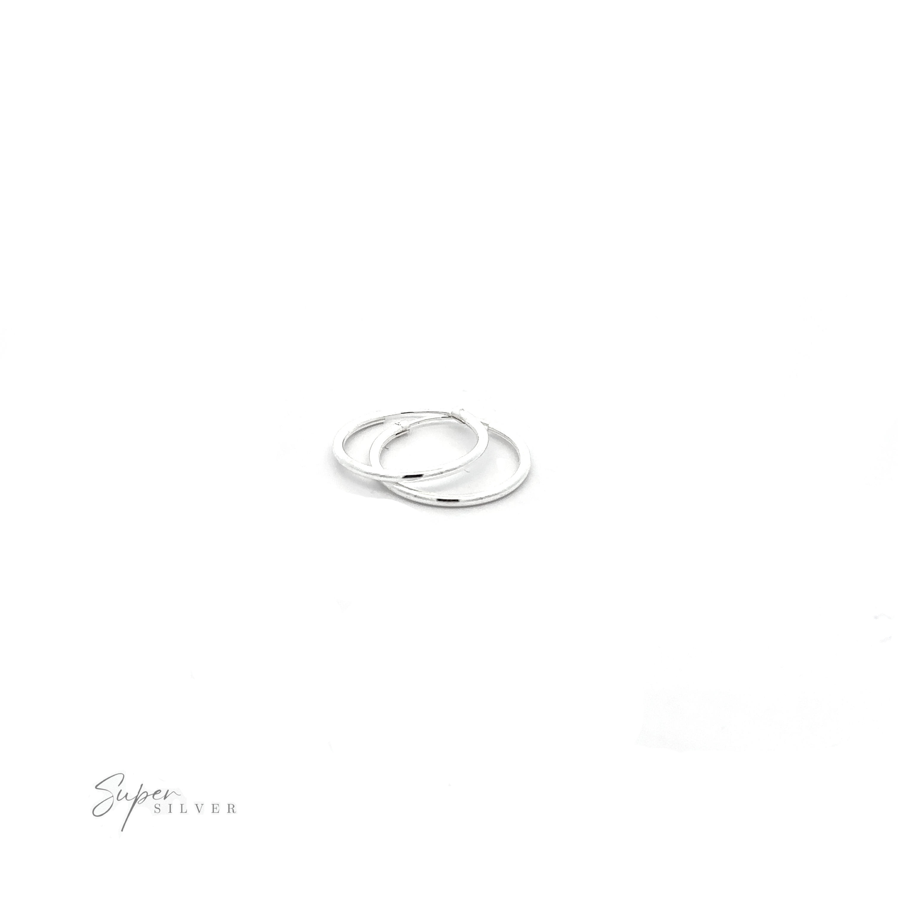 A pair of 1.5mm Infinity Hoops with a minimalist flair on a white background.