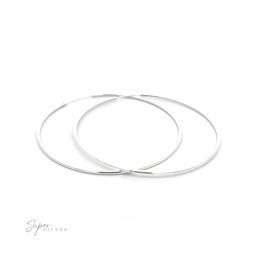 
                  
                    Two 1.5mm Infinity Hoops with a minimalist flair on a white background.
                  
                