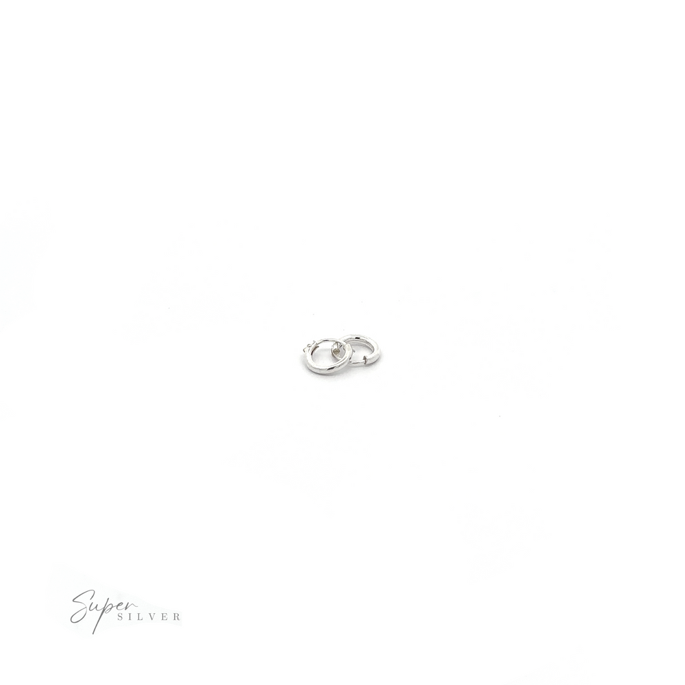 
                  
                    A pair of 1.5mm Infinity Hoops on a white background, adding versatile flair to any outfit.
                  
                