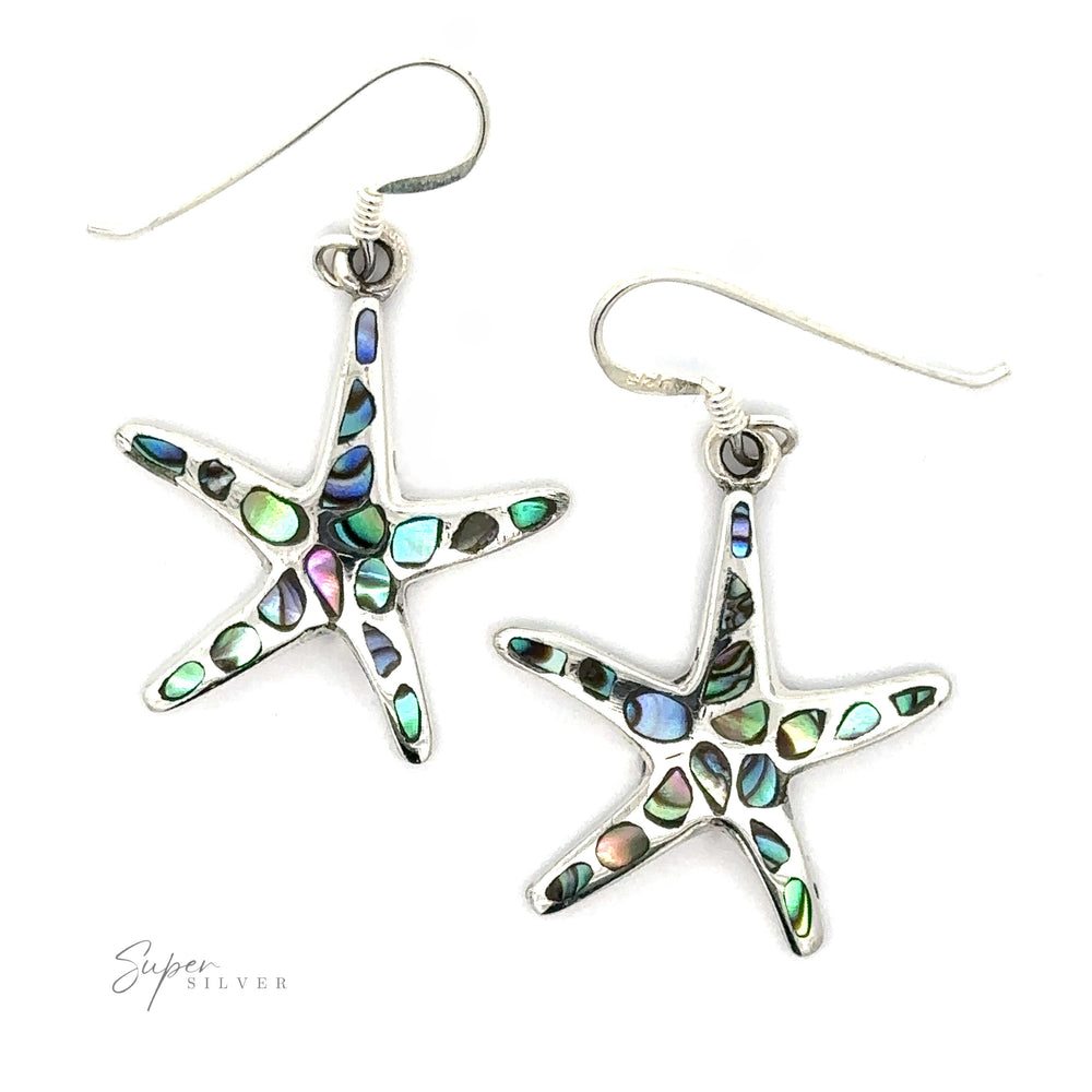 A pair of Abalone Shell Starfish Earrings, presented against a white background.