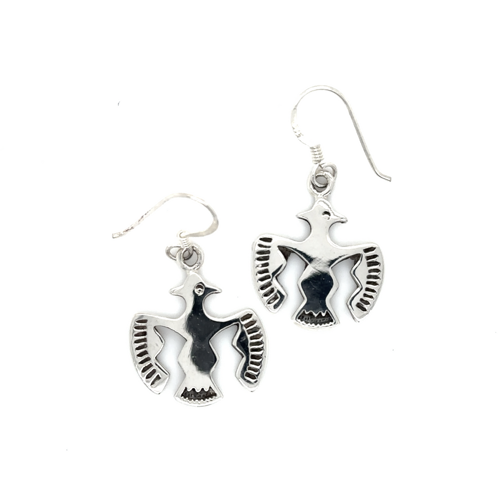 A pair of Thunderbird Earrings by Super Silver, made of .925 Sterling Silver, on a white background.