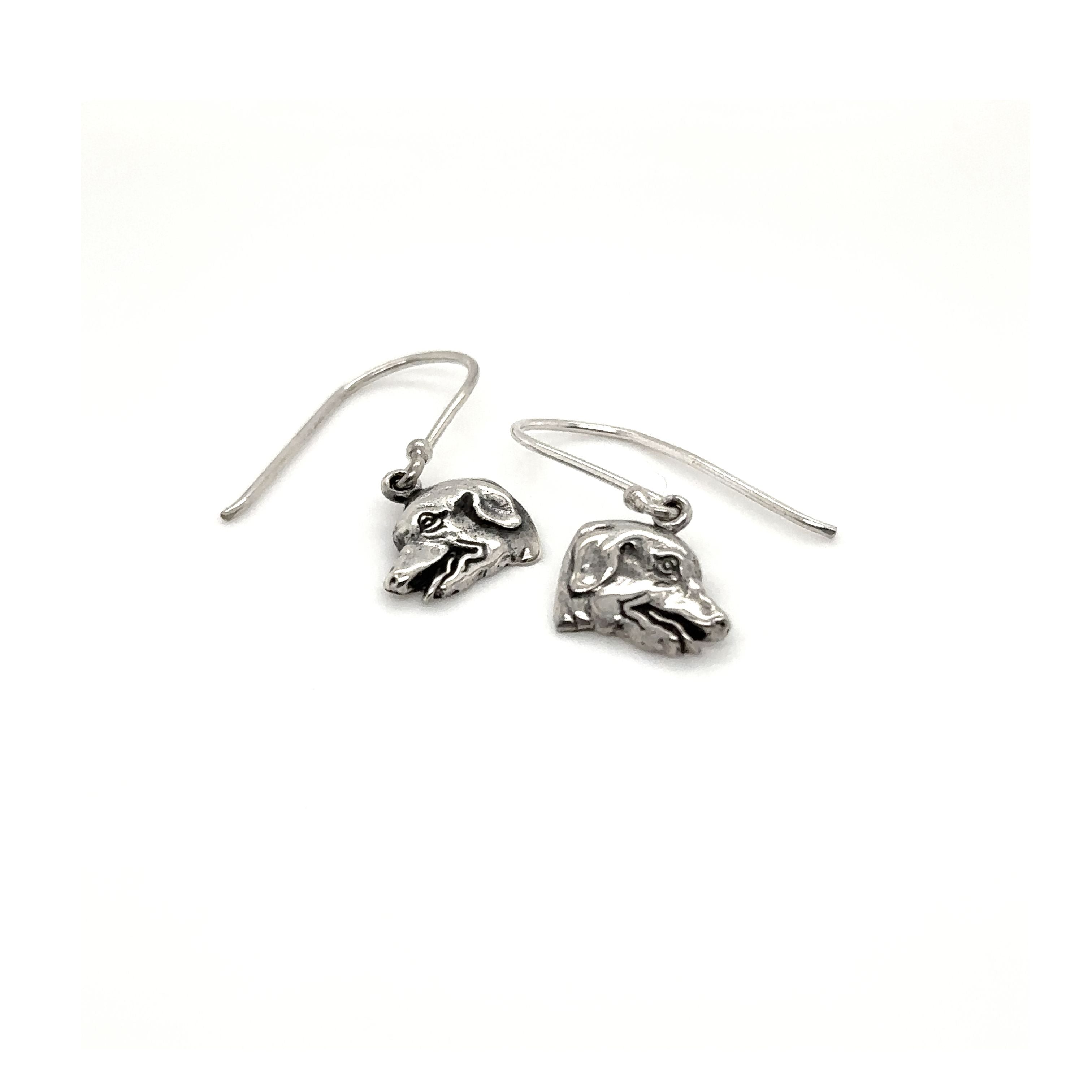 A pair of Dog Earrings from Super Silver with a skull on them.