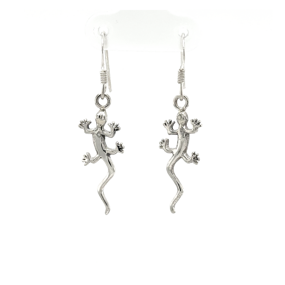 
                  
                    Playful Super Silver Gecko Earrings on a white background.
                  
                