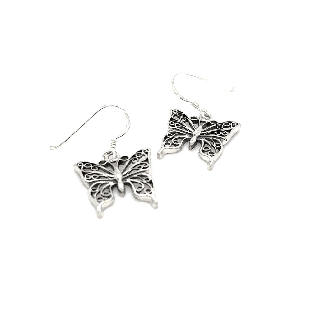 
                  
                    A pair of Super Silver filigree butterfly earrings with sterling silver wings on a white background.
                  
                