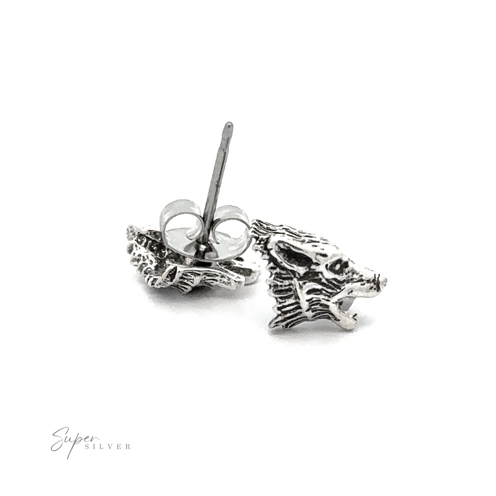 A pair of Wolf Head Studs with a skull on them.