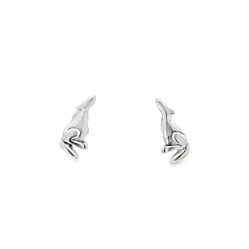 A pair of Howling Wolf Studs on a white background.