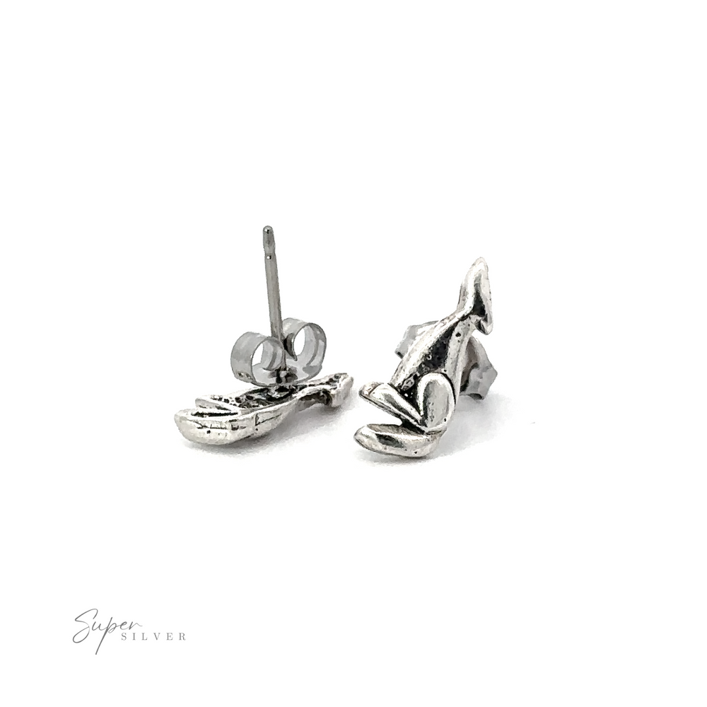 A pair of Howling Wolf Studs, made of .925 Sterling Silver and featuring a southwest styled howling wolf design, showcased on a white background.