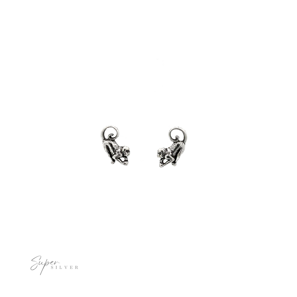 
                  
                    A pair of Monkey Studs on a white background.
                  
                