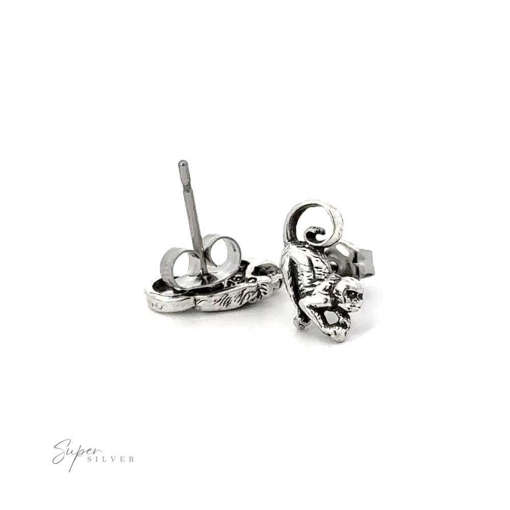 A pair of Monkey Studs with an astronaut on them.