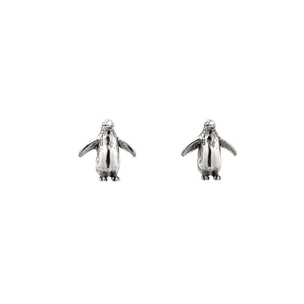 A pair of Penguin Studs, perfect for bird lovers, crafted with sterling silver on a white background.