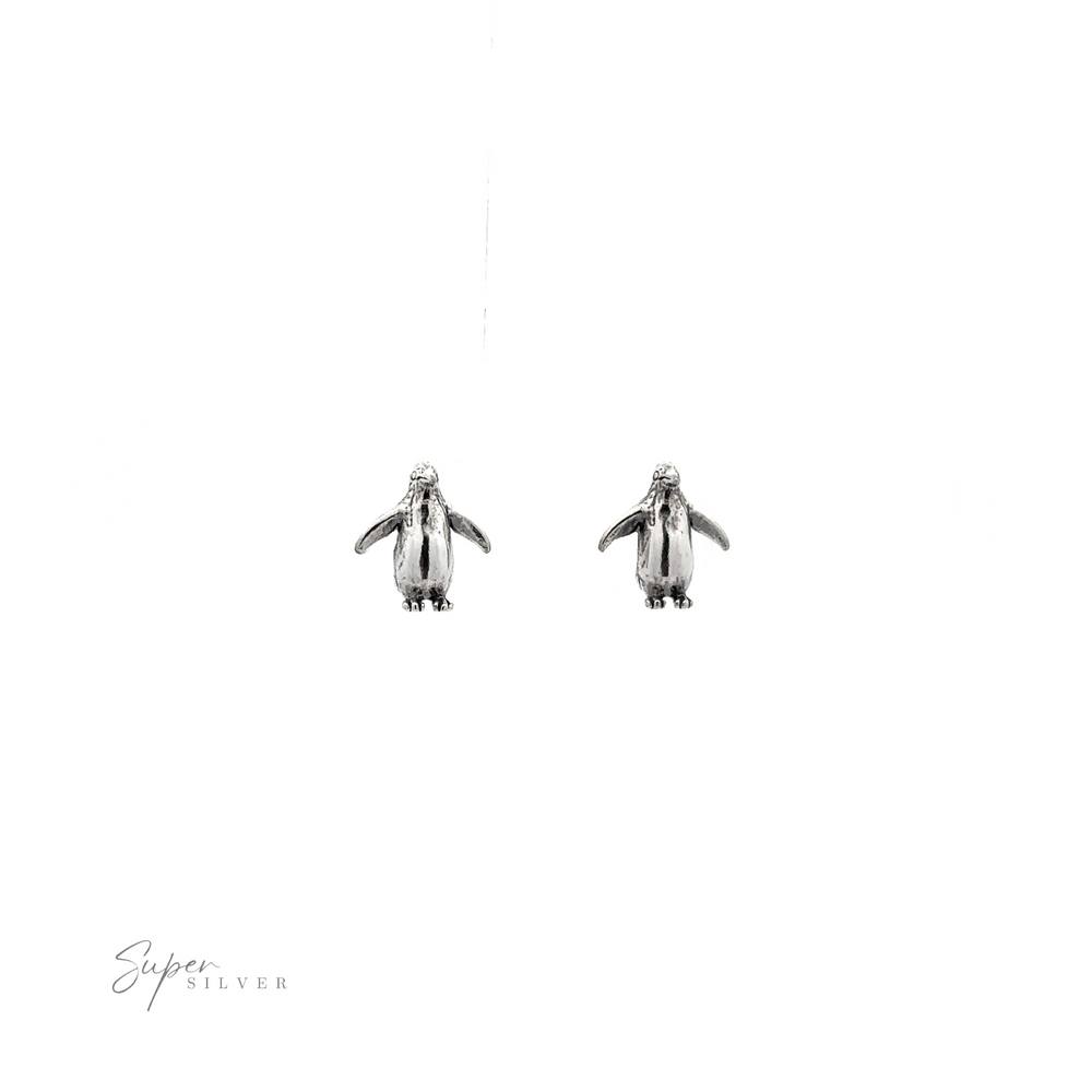 
                  
                    Penguin Studs, perfect for bird lovers, displayed on a white background.
                  
                