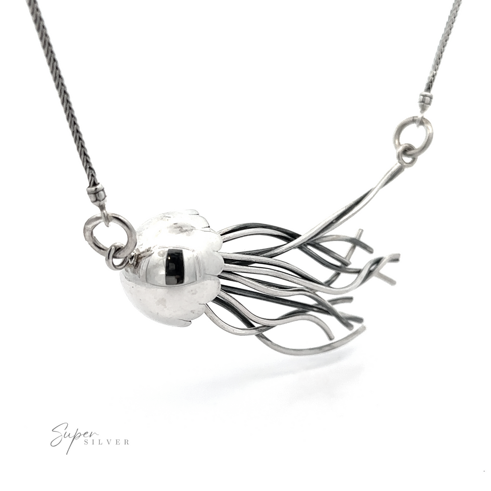 
                  
                    Jellyfish necklace featuring a spherical pendant encased in an abstract, branch-like sterling silver design, displayed against a white background with a signature "super silver.
                  
                