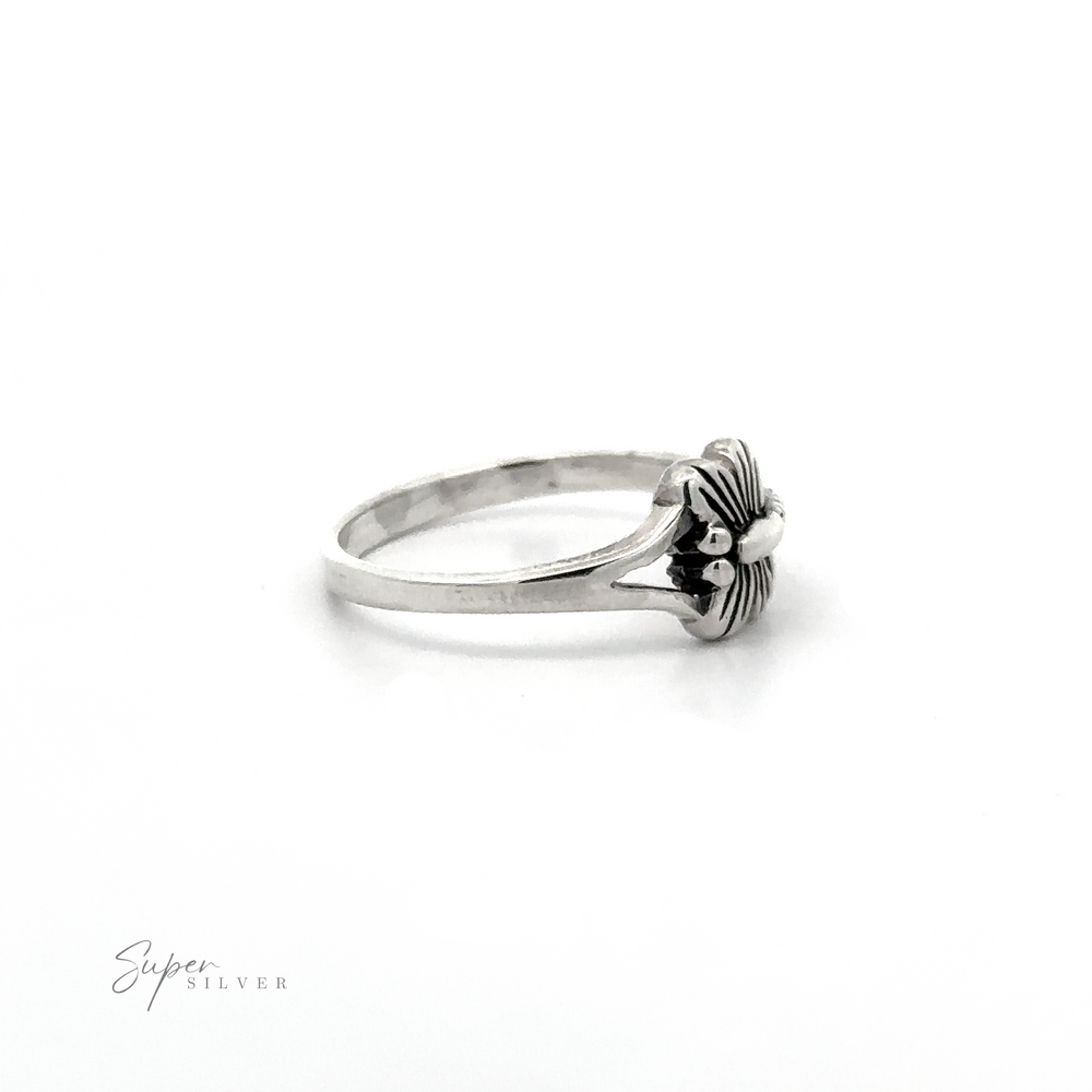 
                  
                    A delicate Small Dragonfly Ring with a flower on it.
                  
                