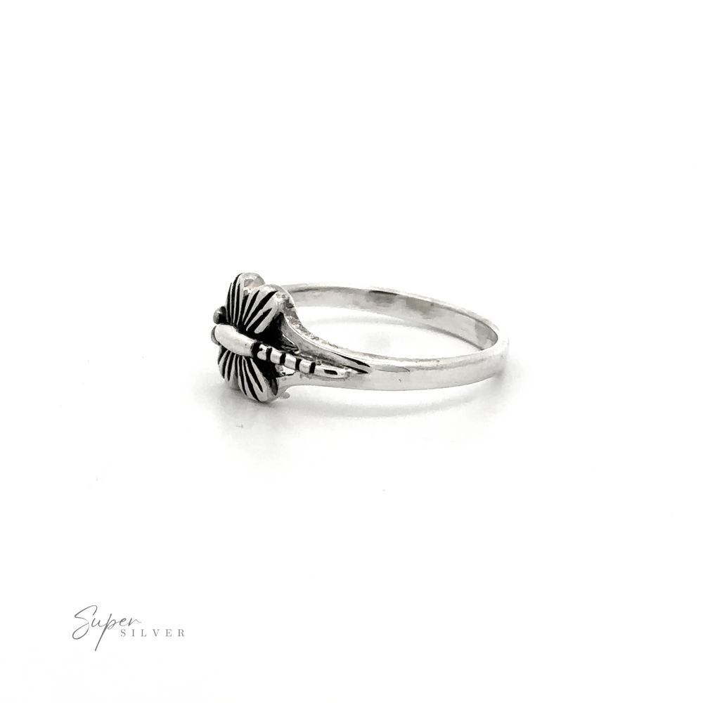 
                  
                    A delicate small dragonfly ring with a cross on it.
                  
                
