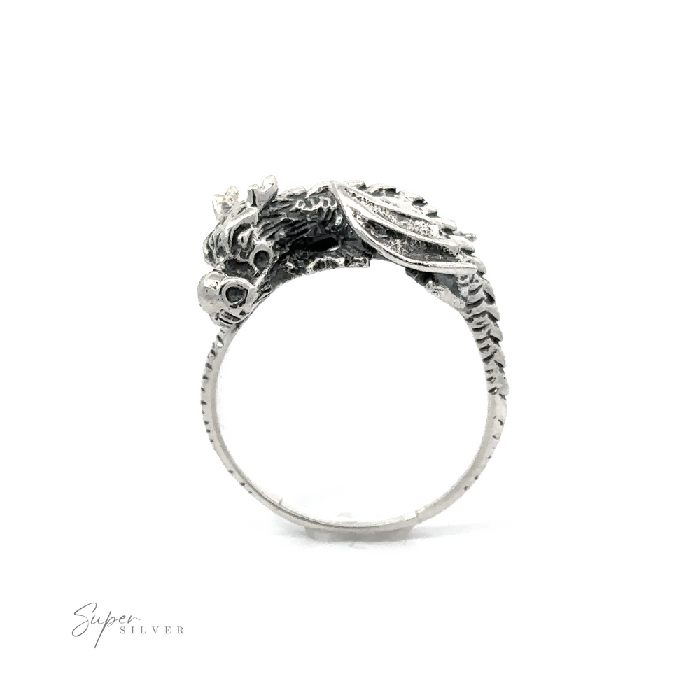 
                  
                    A Heavy Dragon Ring with a tail chasing motif on a white background.
                  
                