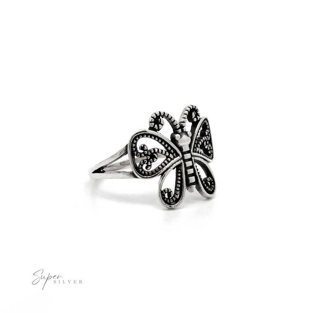 This stunning Butterfly Ring With Swirl Filigree Design showcases an exquisite filigree design on a pure white background.