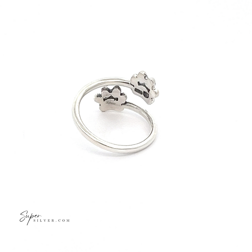 
                  
                    Paw Print Adjustable Ring in sterling silver features two cloud-shaped ends, making it a charming addition to any pet lover's collection, elegantly displayed on a white background.
                  
                