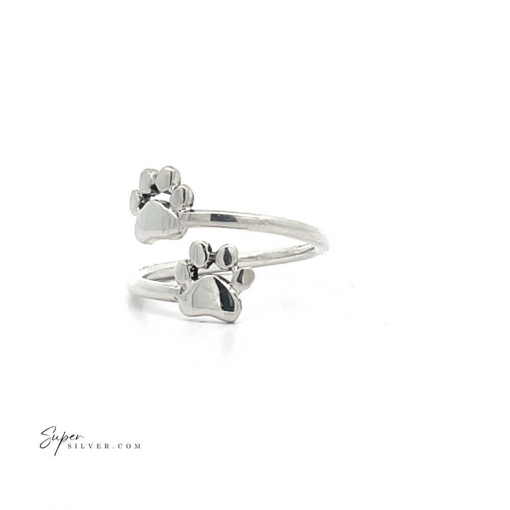 
                  
                    The Paw Print Adjustable Ring is crafted from sterling silver and showcases two delightful paw-shaped designs on a sleek white background, making it an ideal accessory for any pet enthusiast. Offering both style and comfort, this ring's adjustable nature ensures a perfect fit.
                  
                