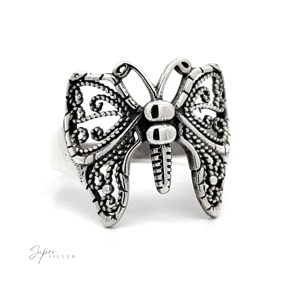 A Beautiful Butterfly Ring With A Wide Band with an ornate design.