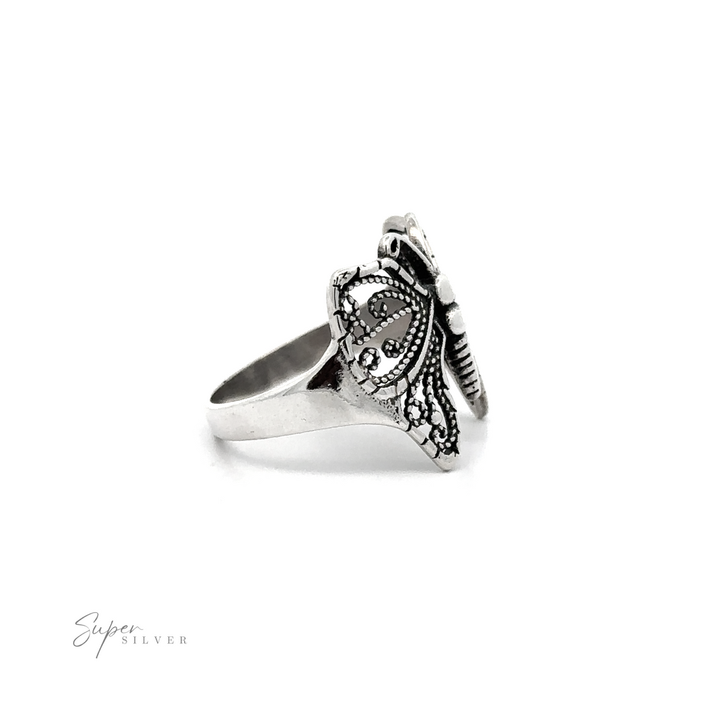 
                  
                    A Beautiful Butterfly Ring With A Wide Band with an ornate butterfly design.
                  
                