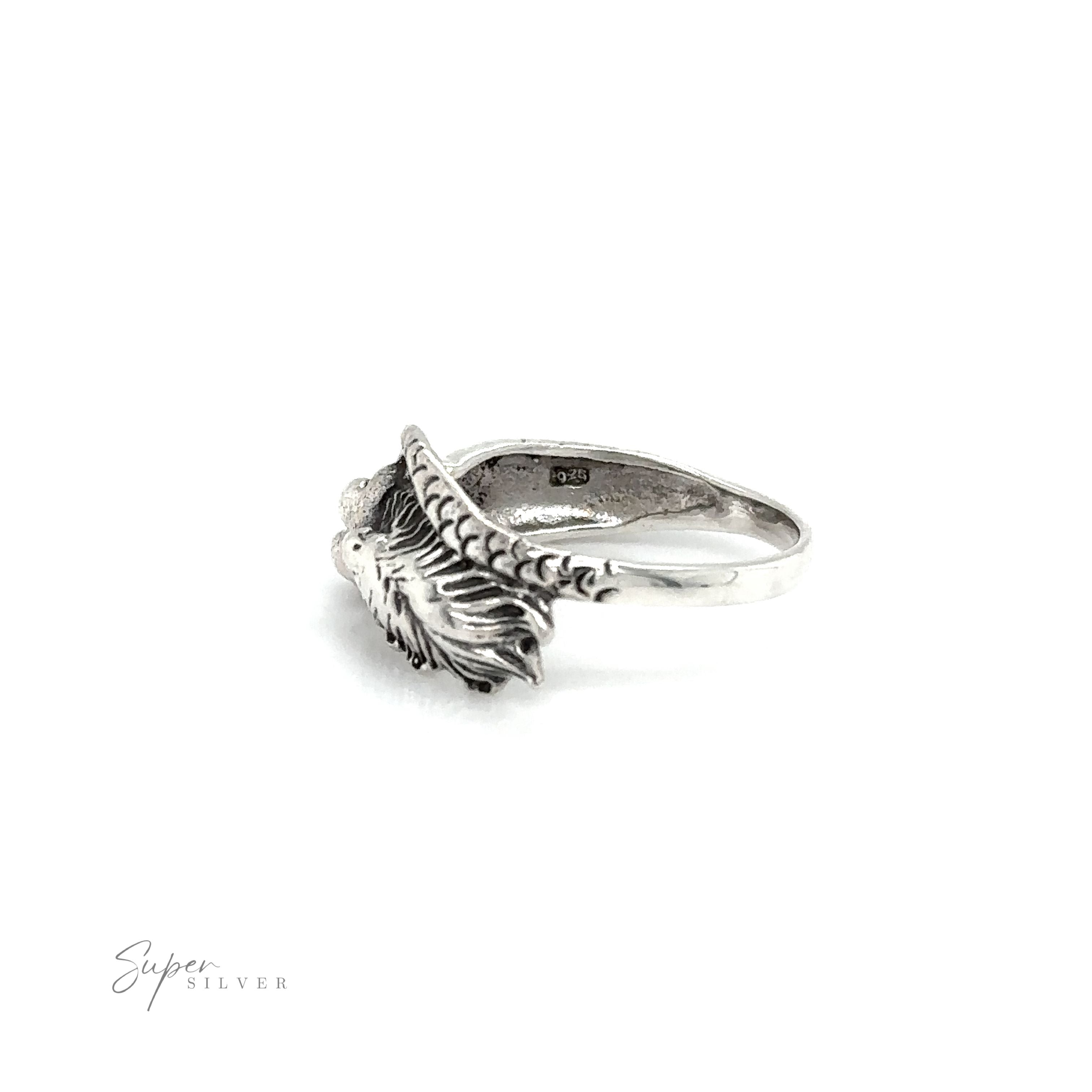 A Mermaid Ring with Swirly Tail with an oceanic feather on it.