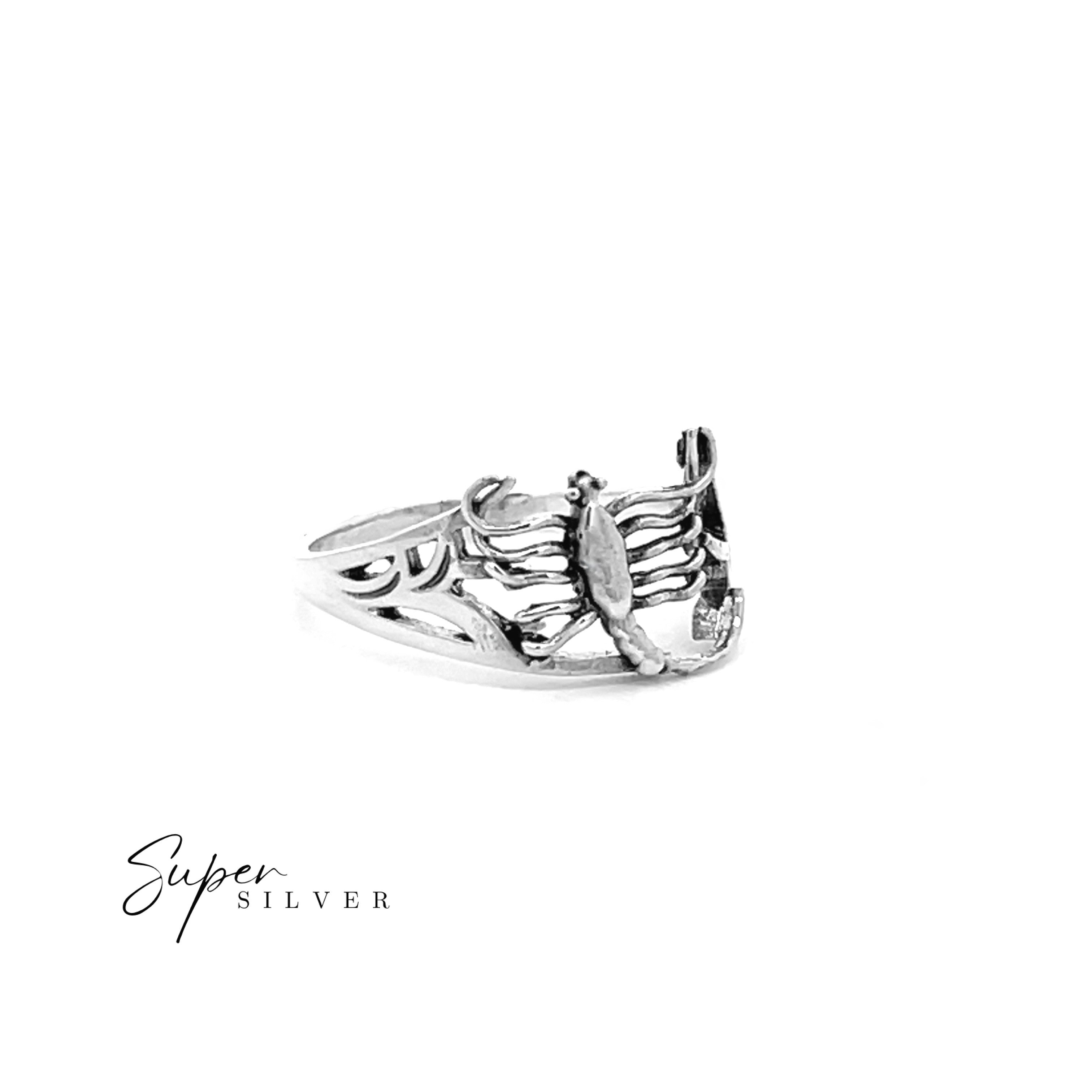 The Dainty Scorpion Ring, crafted in sterling silver with a striking scorpion design on the band, is shown against a white background featuring "Super Silver" in the lower left corner.