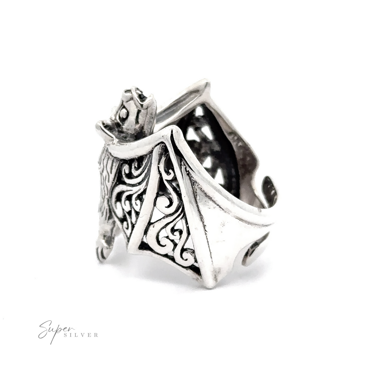 Statement Bat Ring resembling a stylized dragon with intricate designs, isolated on a white background.