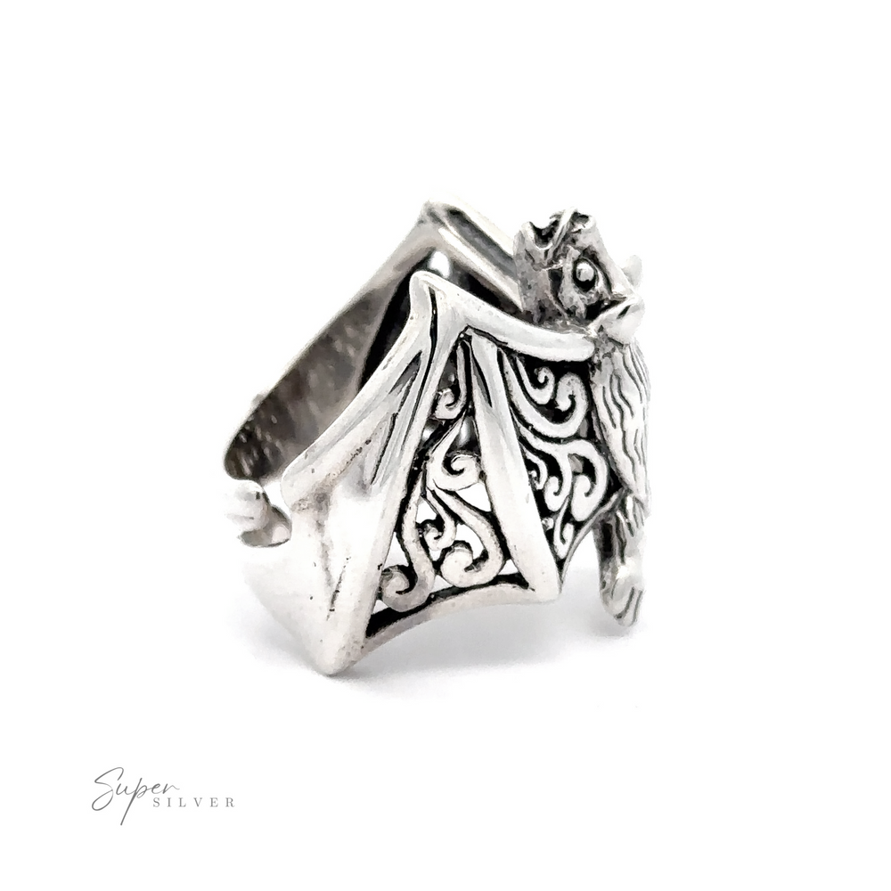 
                  
                    Statement Bat Ring with an intricate owl design and Celtic patterns on a white background.
                  
                