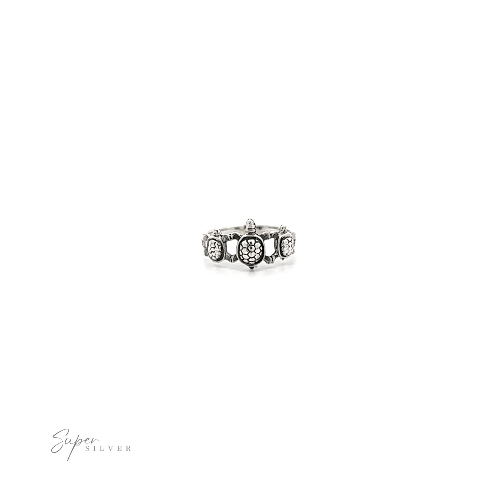 
                  
                    A Three Turtles Ring with diamonds on a white background.
                  
                