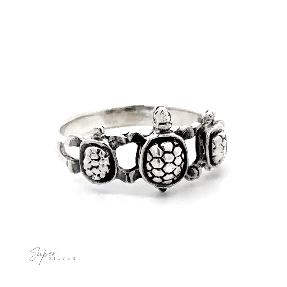 
                  
                    A silver Three Turtles Ring.
                  
                