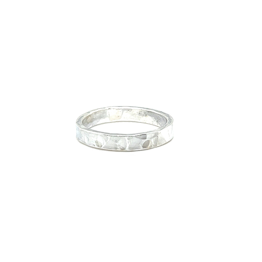 A Super Silver 3mm Flat Hammered Band ring with a contemporary twist.
