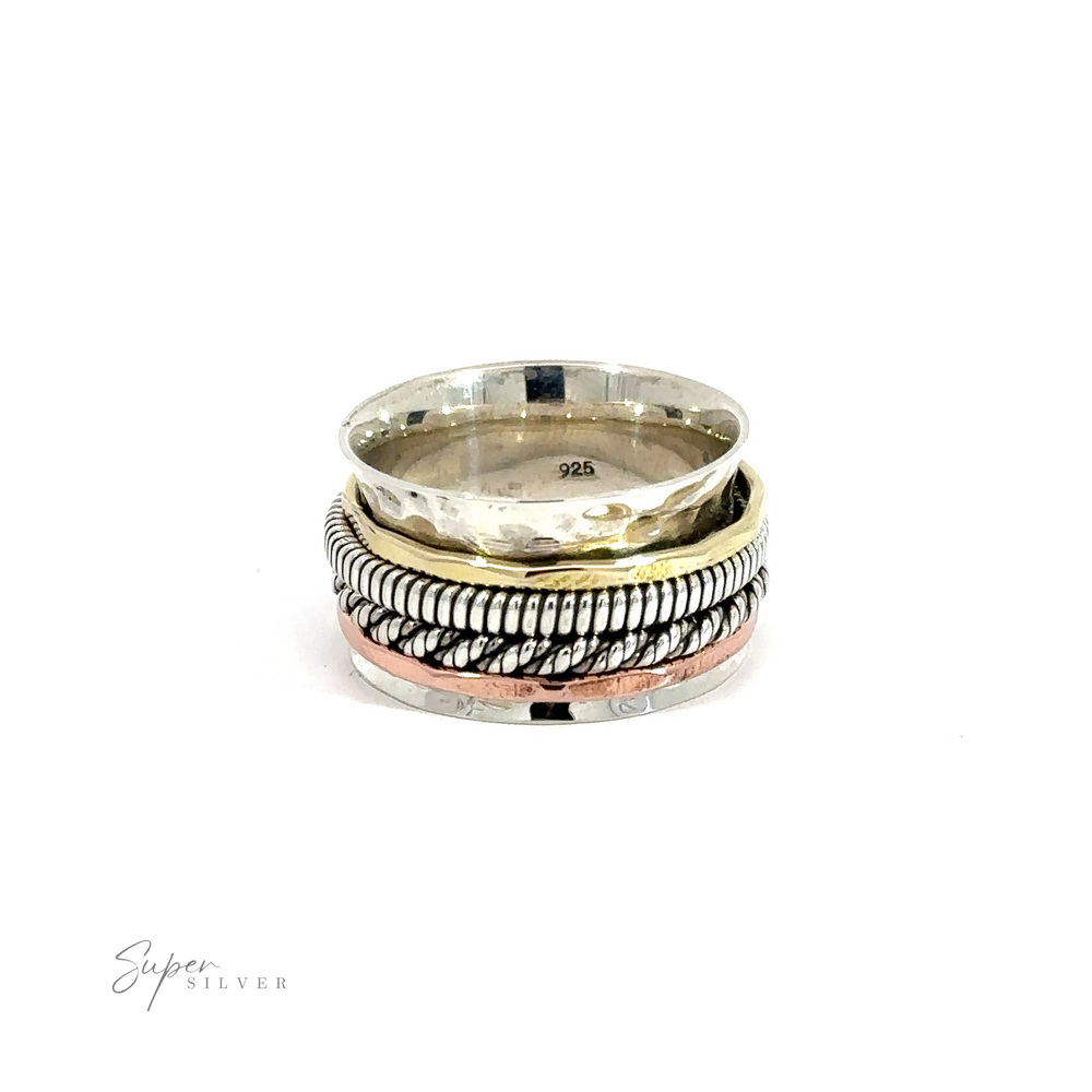 A Handmade Spinner Ring with Two Rope Styled Bands and a braided tricolor pattern.