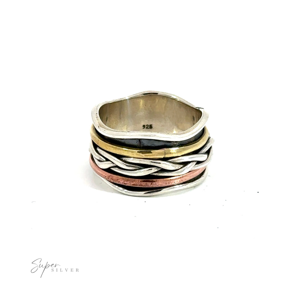 A Handmade Spinner with Gold, Copper, and a Braided Silver Band ring.