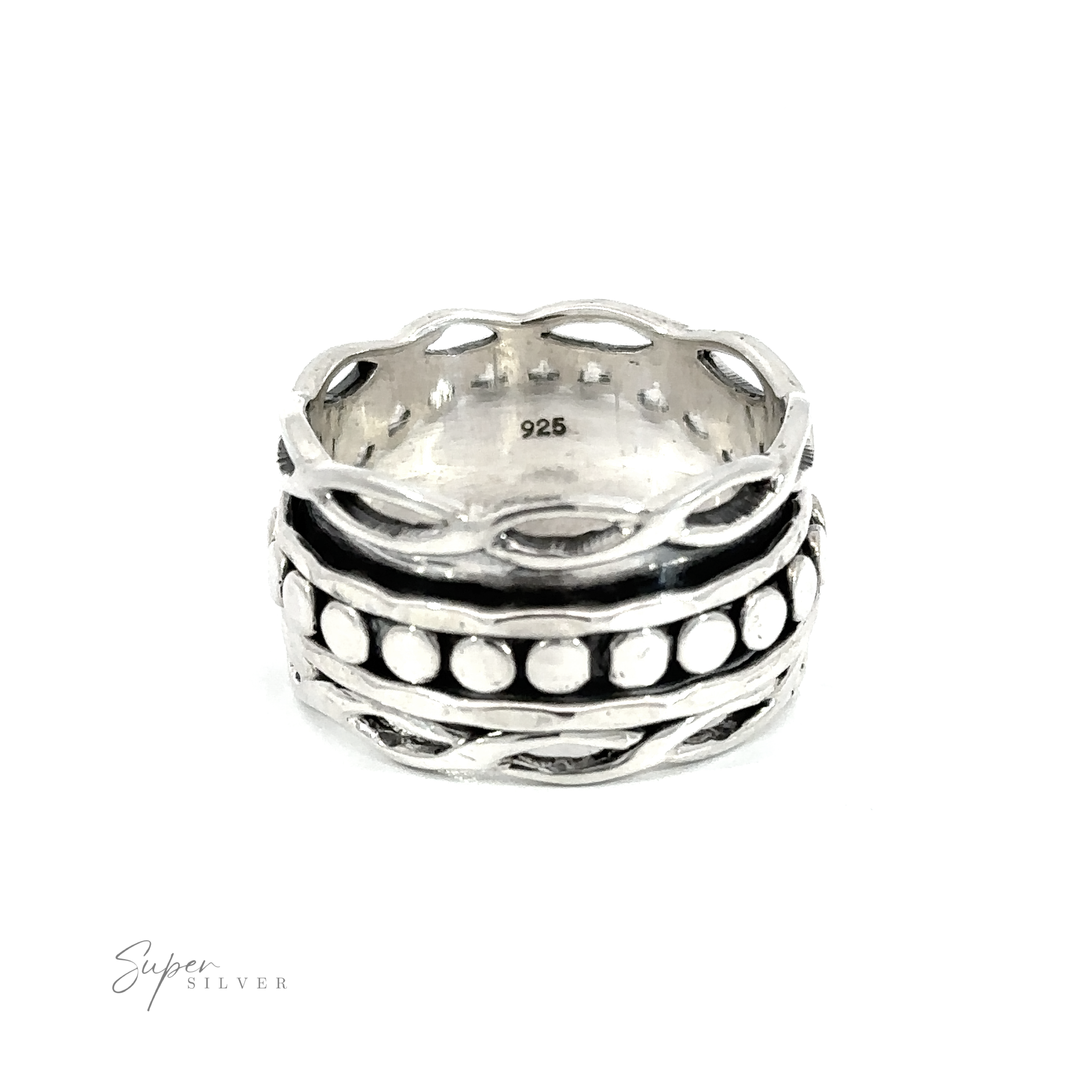 A Spinner Ring with Twisted Borders with hammered bands and black and white dots on the circle band.